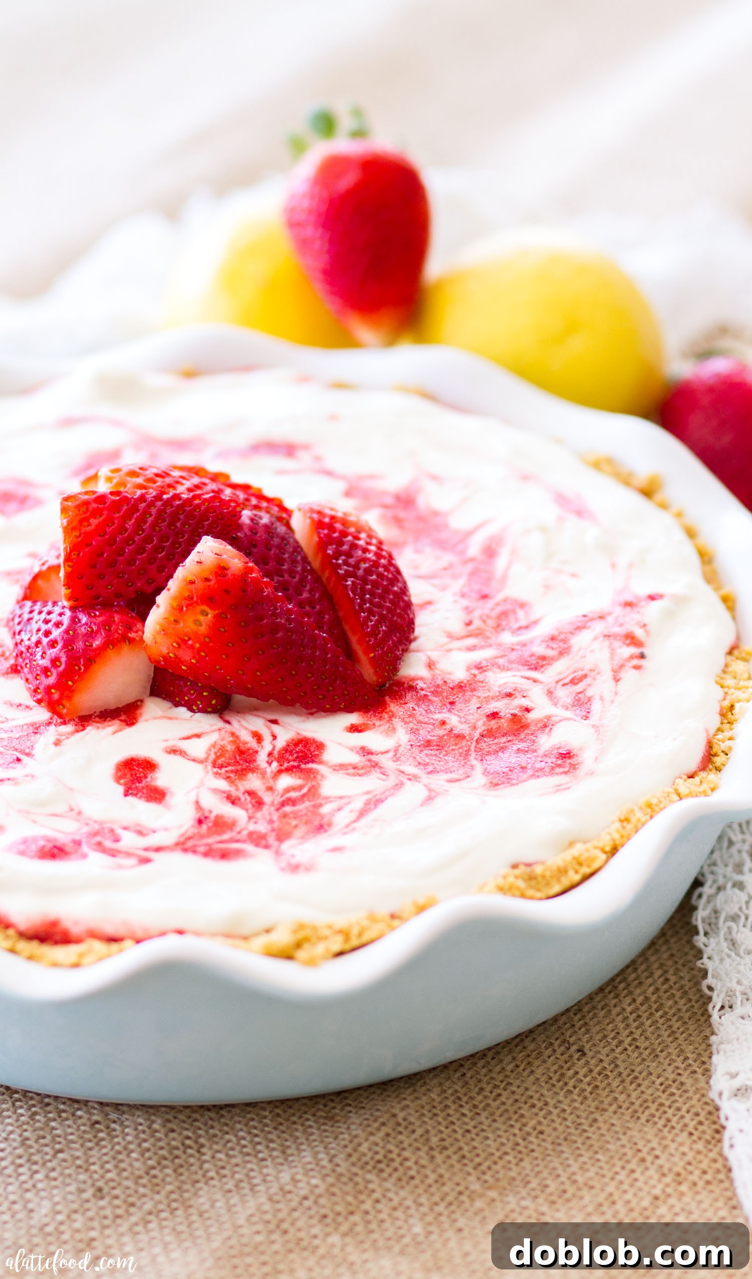 Overhead view of Strawberry Lemonade Icebox Pie with fresh strawberries