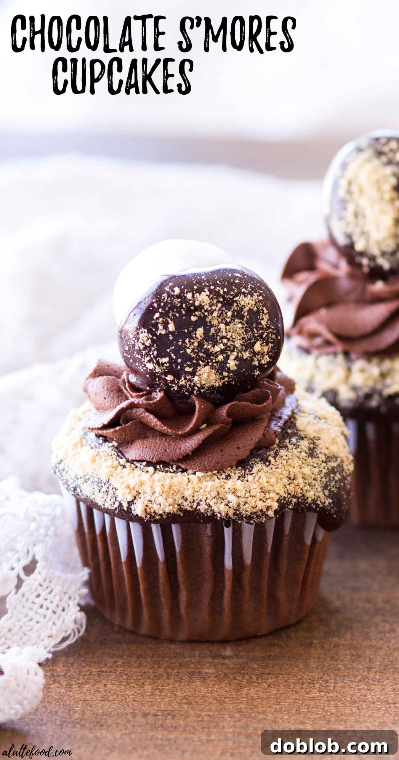 An up-close, mouth-watering shot of a chocolate s'mores cupcake revealing its rich texture and toppings