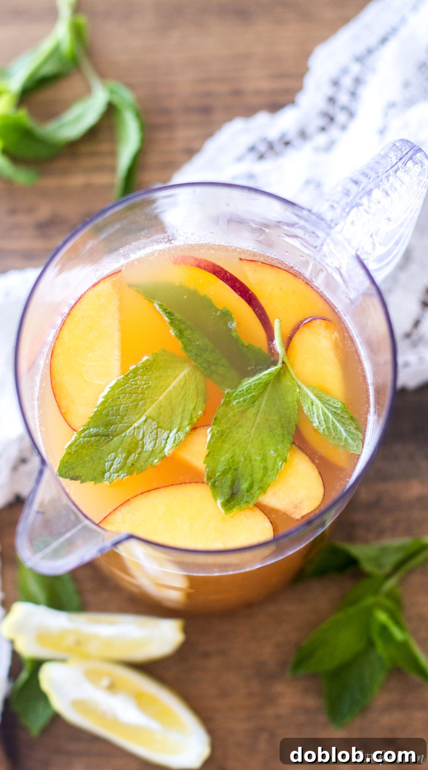 Preparing ingredients for homemade Iced Peach Green Tea: fresh peaches and green tea bags.