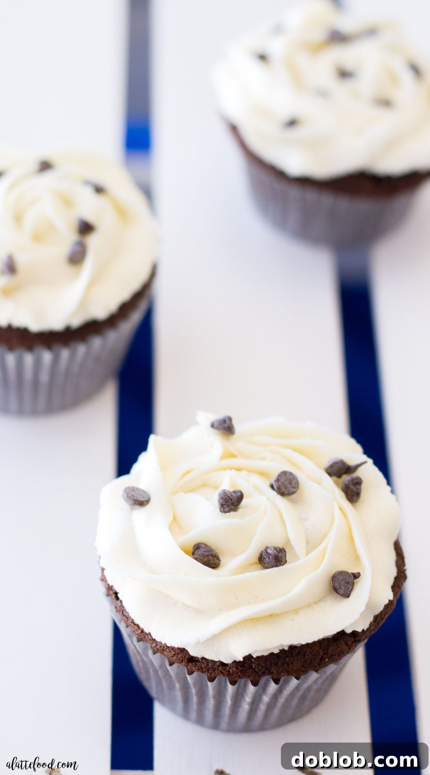 Close-up of a perfectly baked chocolate cupcake, revealing the rich Oreo truffle center, ready for vanilla buttercream and enjoyment.