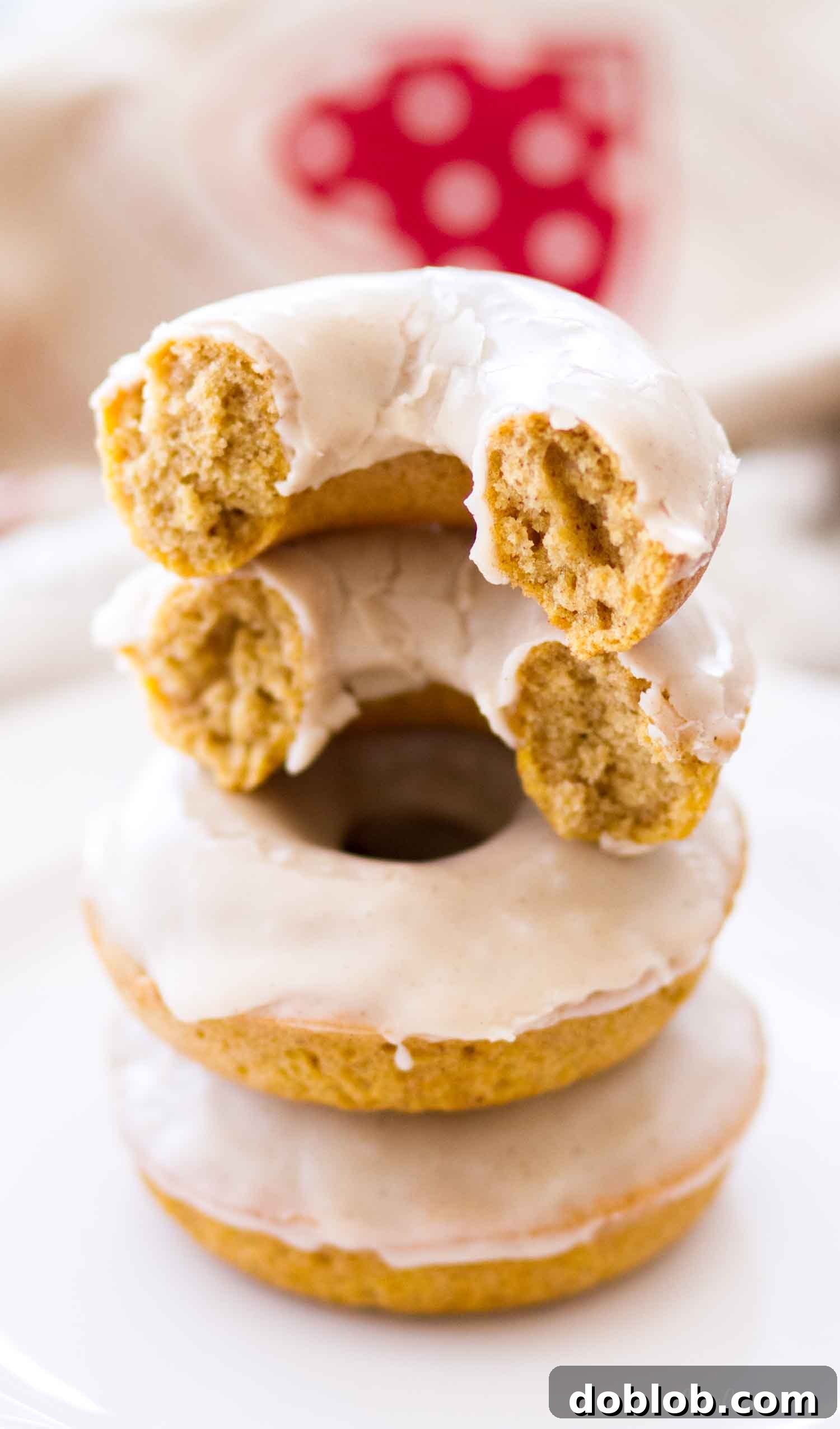 Interior View of Baked Spiced Pumpkin Donuts The moist and spiced interior of glazed pumpkin donuts, showcasing their tender crumb and rich texture.