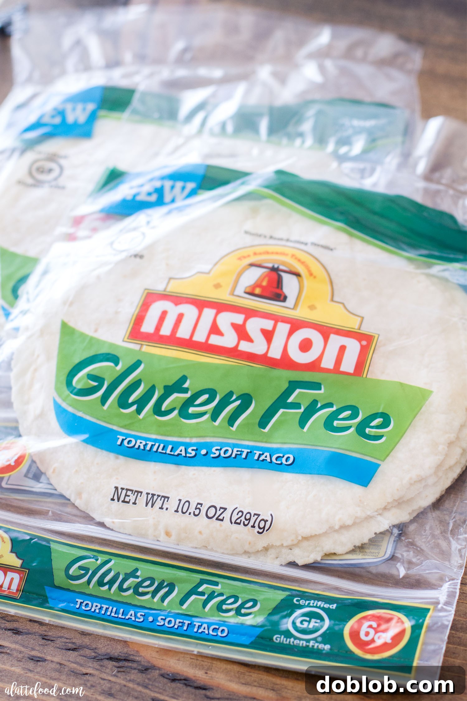 Hearty Oven-Baked Chicken & Avocado Burritos 5 Several Baked Avocado Chicken Burritos artfully arranged on a serving plate, garnished with fresh cilantro and lime wedges, ready to be enjoyed.