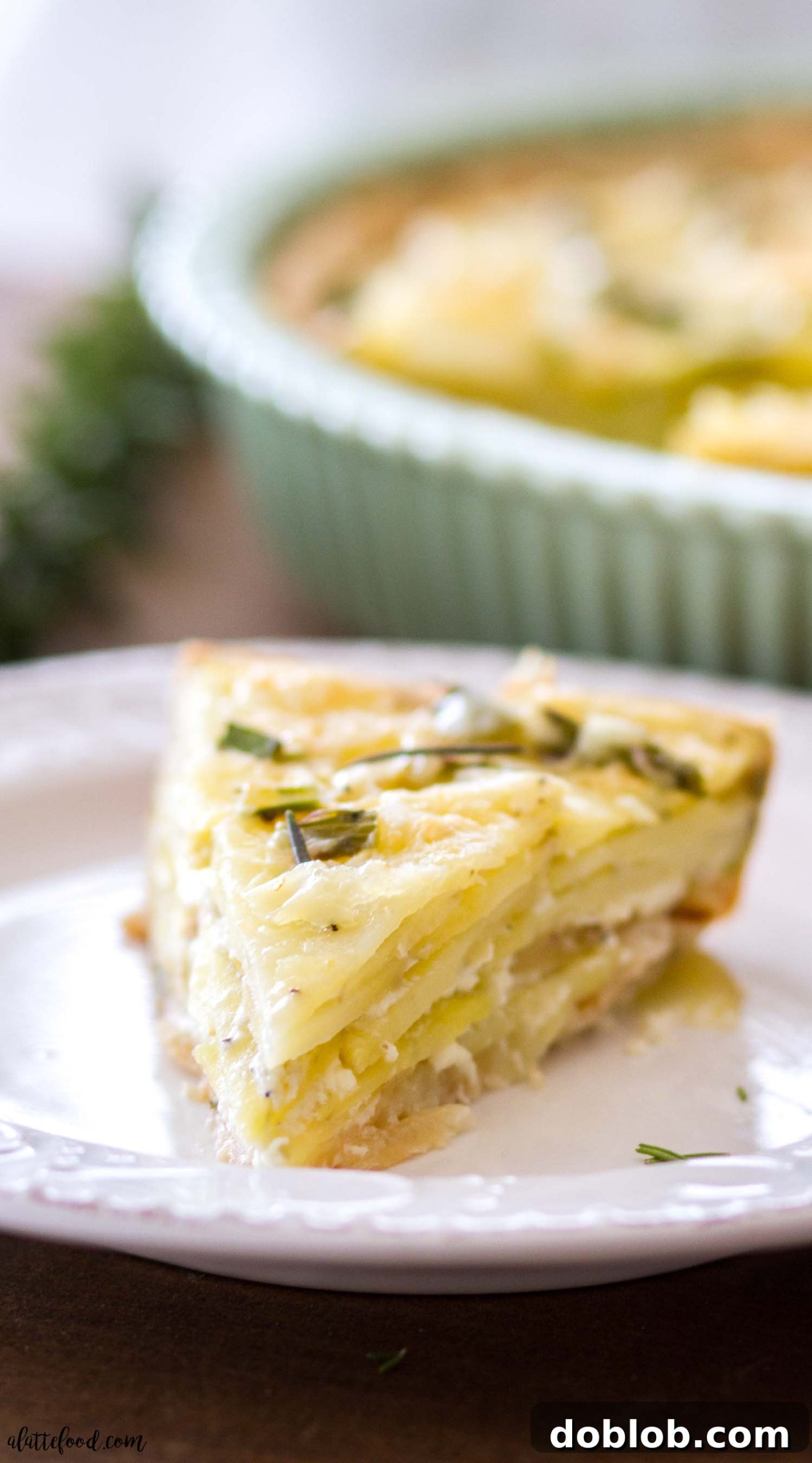 Two Cheesy Asparagus Potato Tarts cooling on a wire rack, showcasing their golden crust and savory filling.