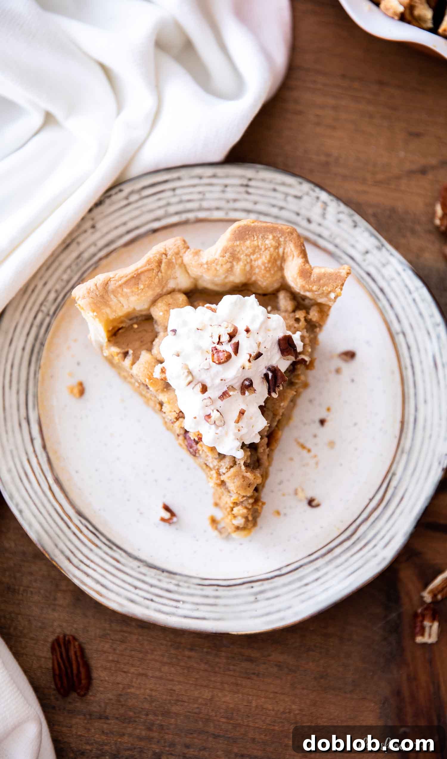  slice of pumpkin streusel pie on stone plate