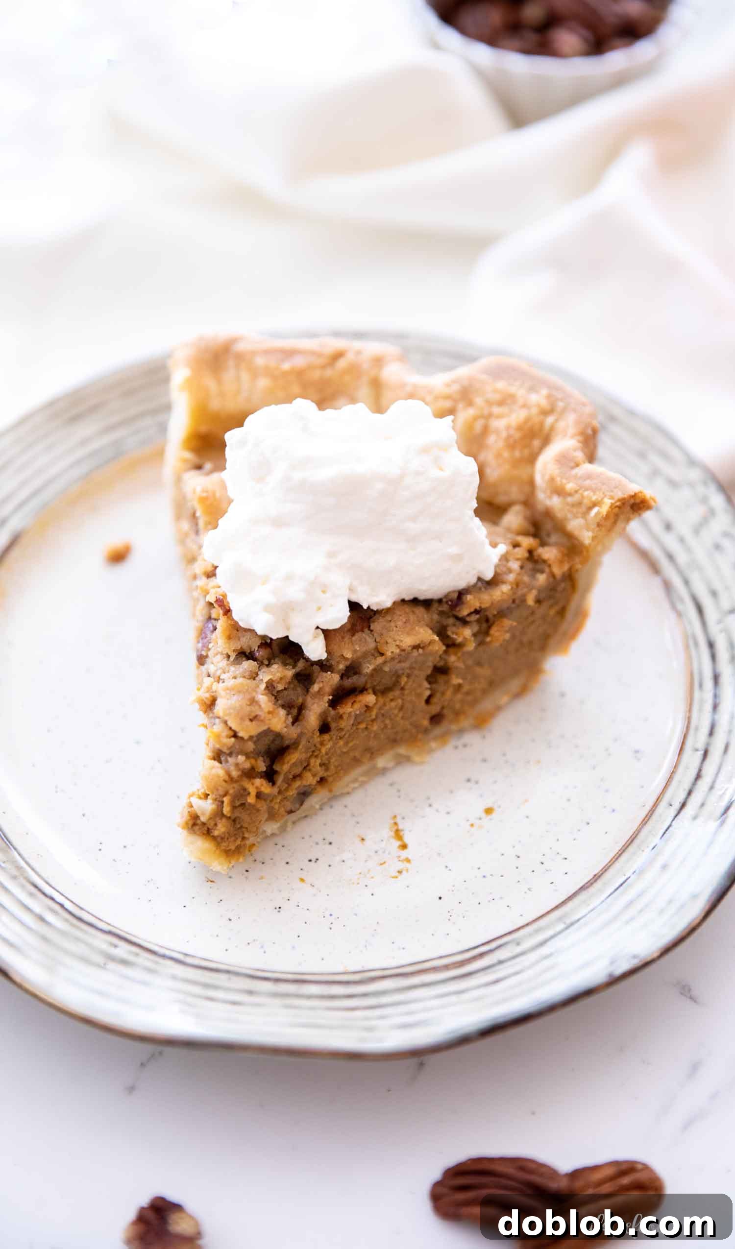 apple pumpkin pie slice on tan plate