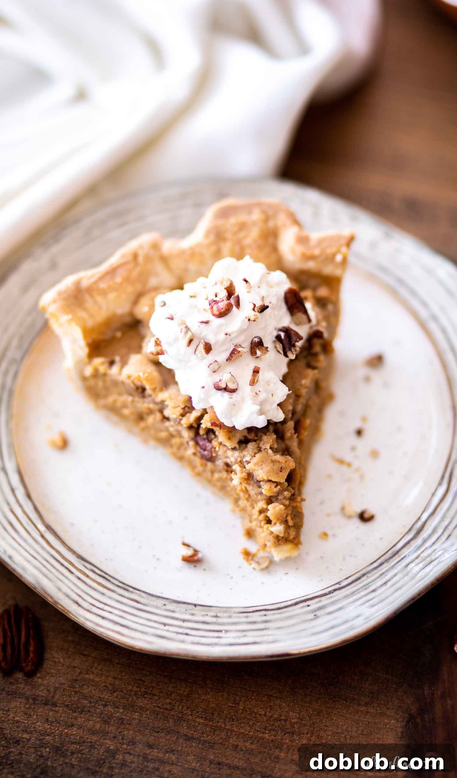 slice of pumpkin apple butter pie with whipped cream