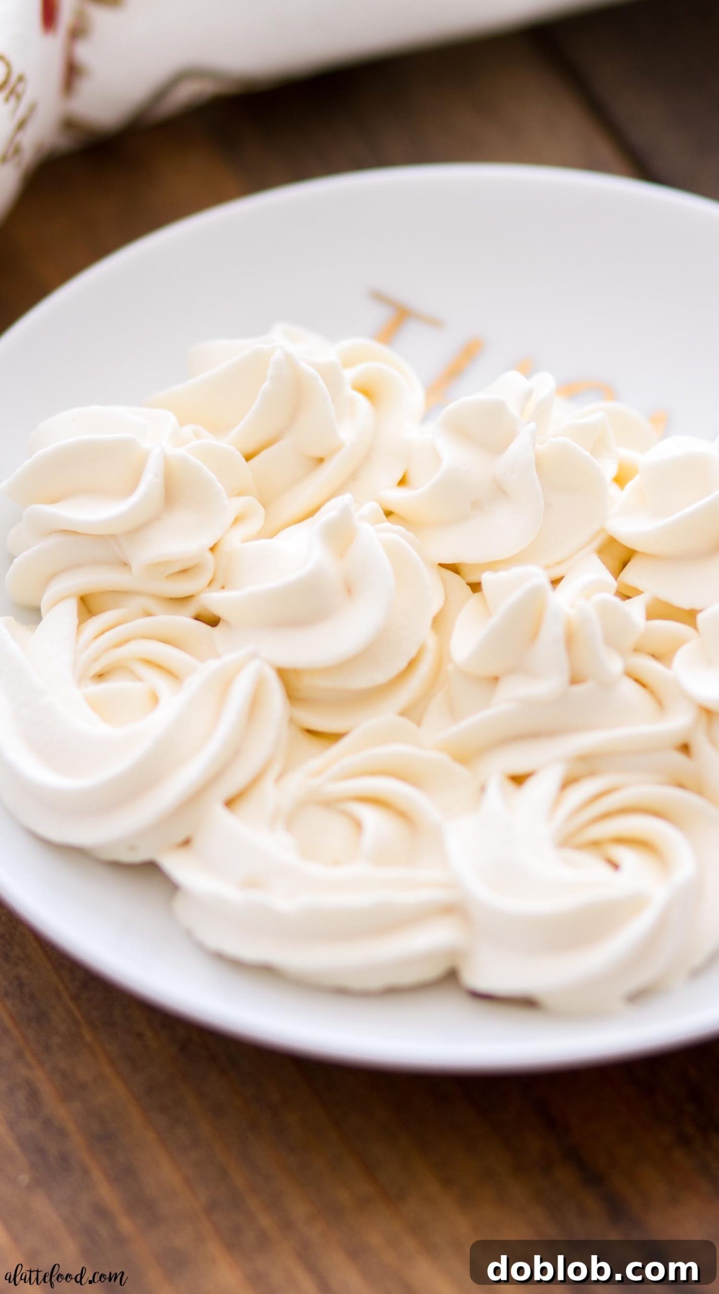 Caramel Whipped Cream Ready to Serve A bowl of freshly made Caramel Whipped Cream with a spoon, ready to be served