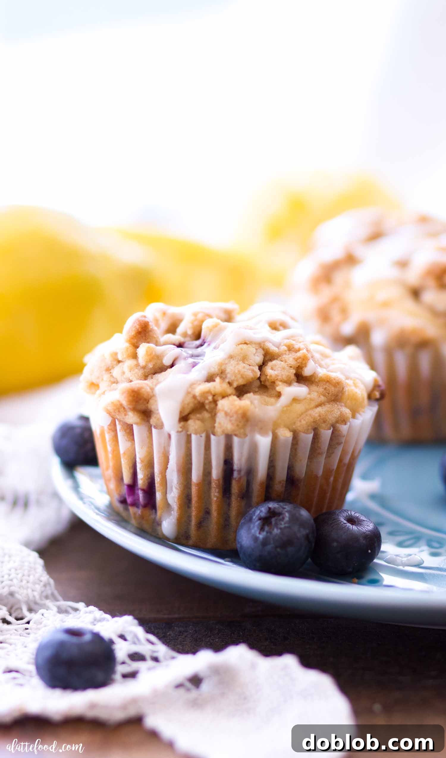 The best Lemon Blueberry Muffins for breakfast or brunch Beautiful blueberry muffins adorned with a luscious lemon glaze, ready to be enjoyed
