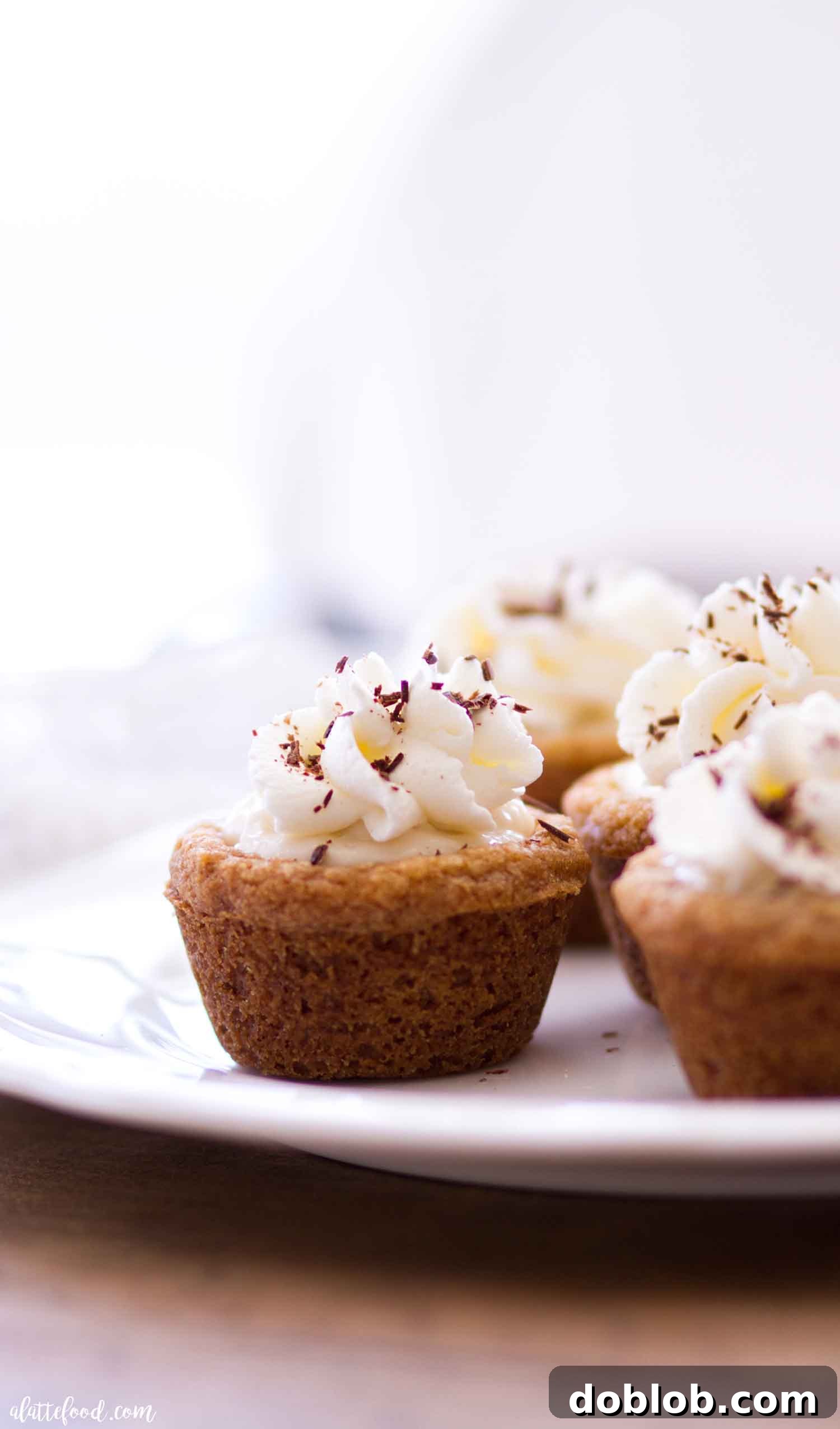 Collection of S'mores Cookie Cups for a Party Several freshly made S'mores Cookie Cups arranged artfully on a serving tray, highlighting their perfect size and inviting texture.