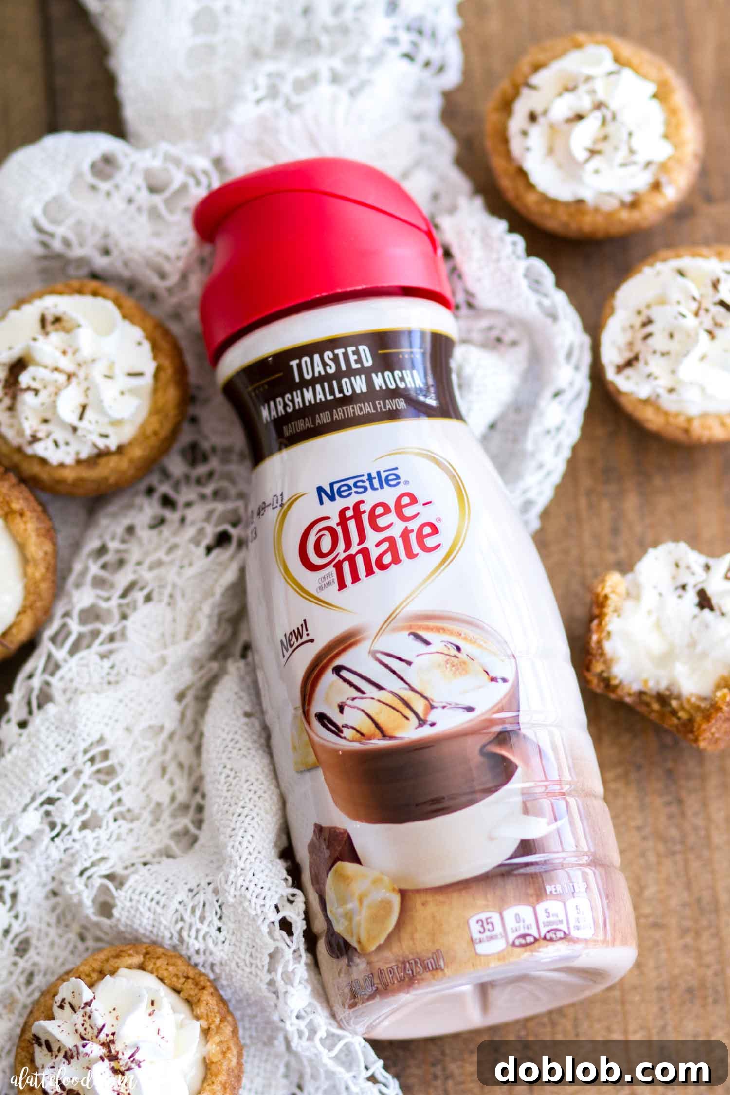 Overhead Shot of S'mores Cookie Cups An overhead view of several S'mores Cookie Cups on a light background, arranged to showcase their appealing presentation.