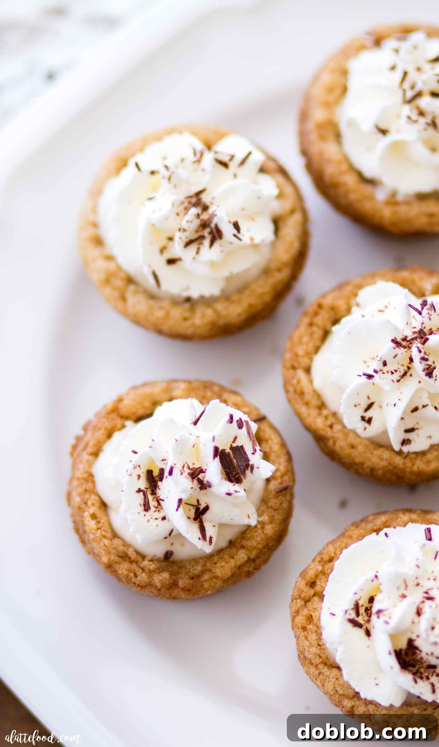 Clean and Vibrant S'mores Cookie Cup Display A bright, inviting image of S'mores Cookie Cups arranged on a clean white surface, emphasizing their aesthetic appeal.