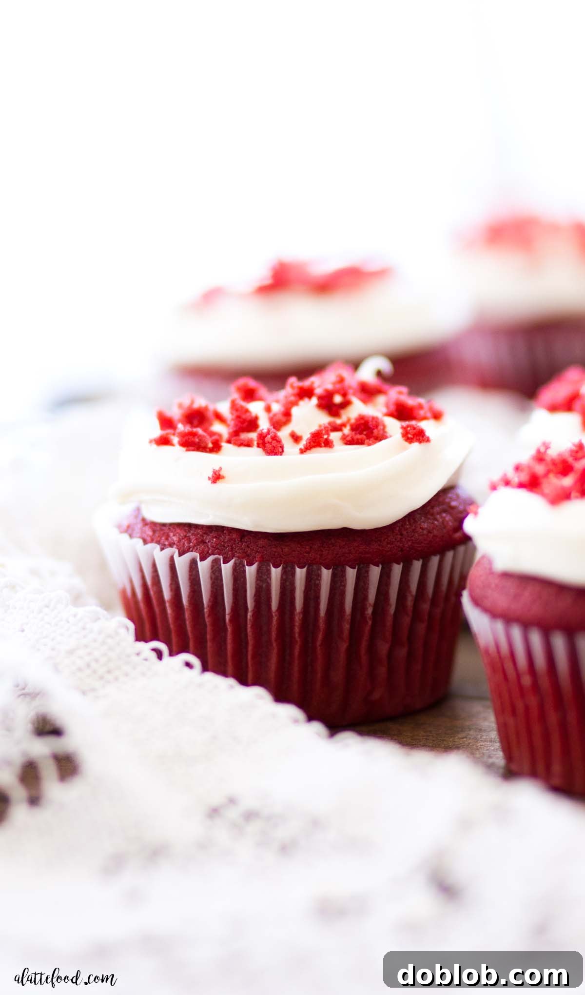 Heavenly Red Velvet Cupcakes 9 cream cheese frosted red velvet cupcake on wooden board