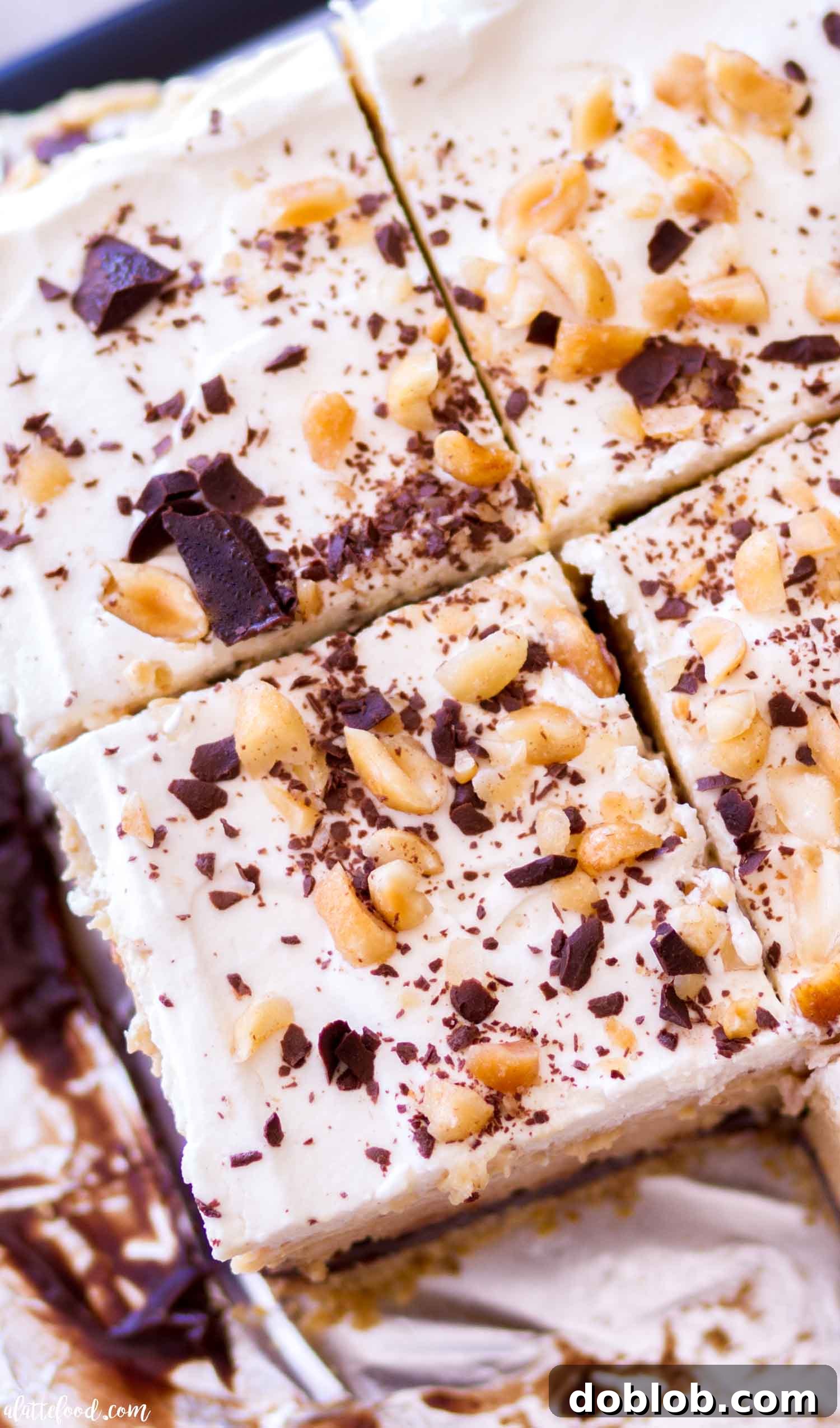 No-bake chocolate peanut butter pie bars set in a pie tin, ready for the final layers and chilling.