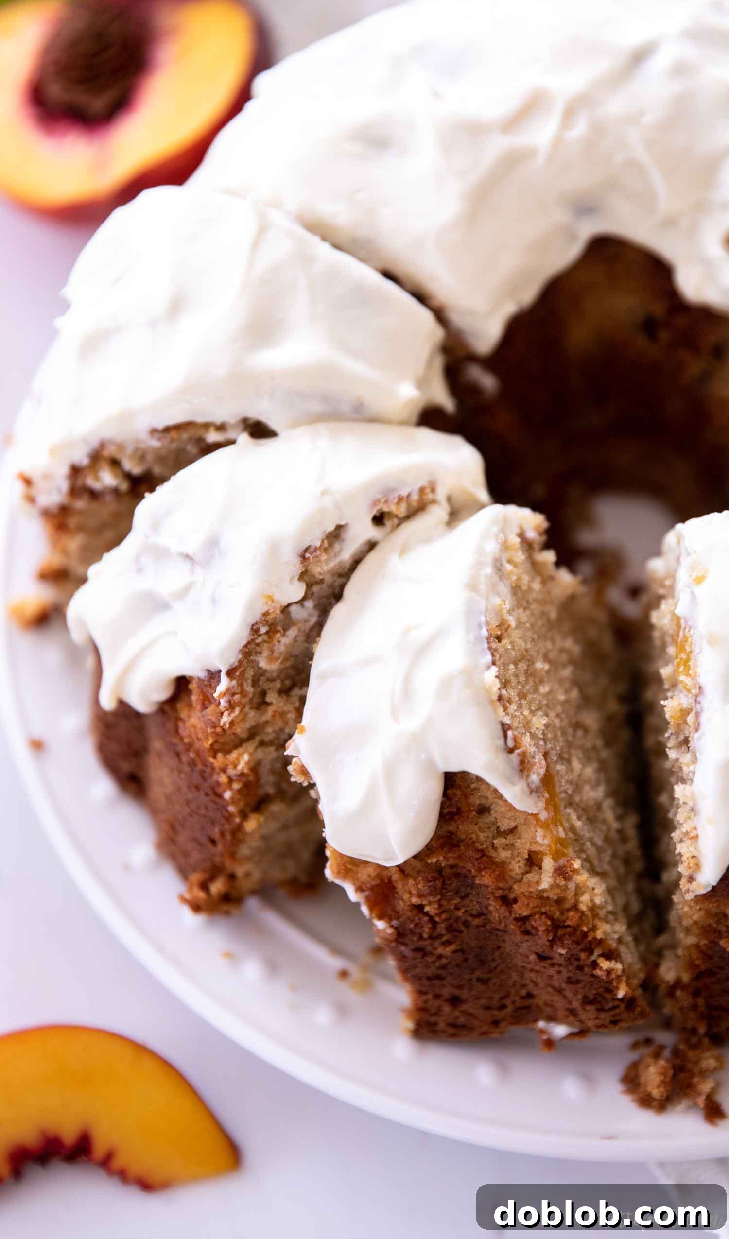 A sliced peach pound cake resting on a plate, ready to be served.