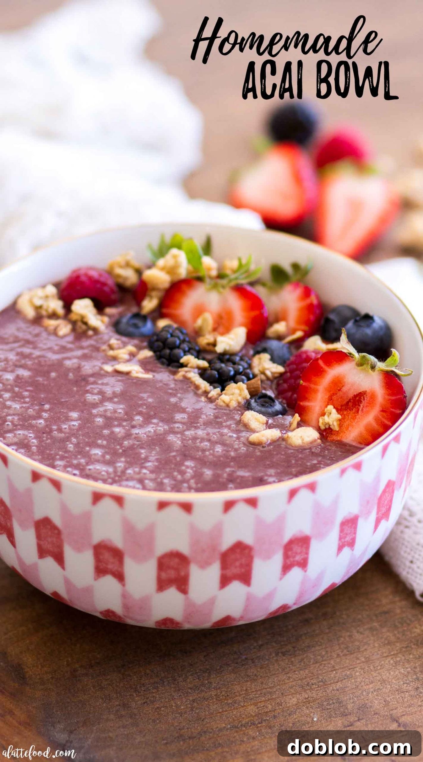 A classic Açaí bowl artfully arranged in a rustic bowl, topped with a mix of fresh blueberries, sliced kiwi, and crunchy granola. The rich purple Açaí base provides a striking contrast to the colorful toppings. Keywords: classic Acai bowl, berries, granola, kiwi, healthy breakfast, easy recipe, superfood.