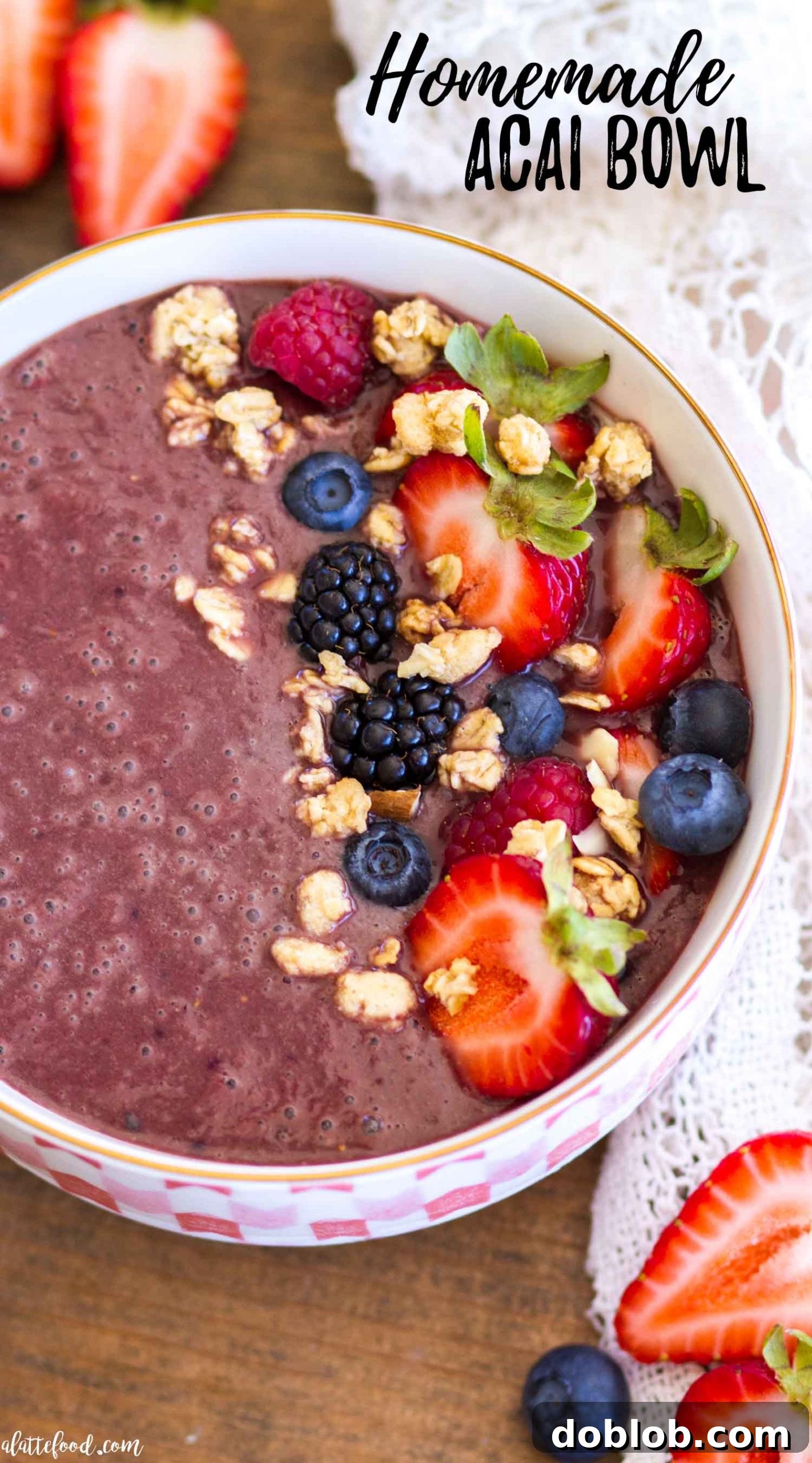 A beautifully prepared homemade Açaí bowl, generously topped with an assortment of fresh berries including whole blueberries and sliced strawberries, a sprinkle of granola for crunch, and delicate coconut flakes. The rich, purple Açaí base is perfectly thick and inviting. Keywords: homemade Acai bowl, granola, berries, coconut, healthy breakfast, gluten-free, refined sugar-free, customizable.