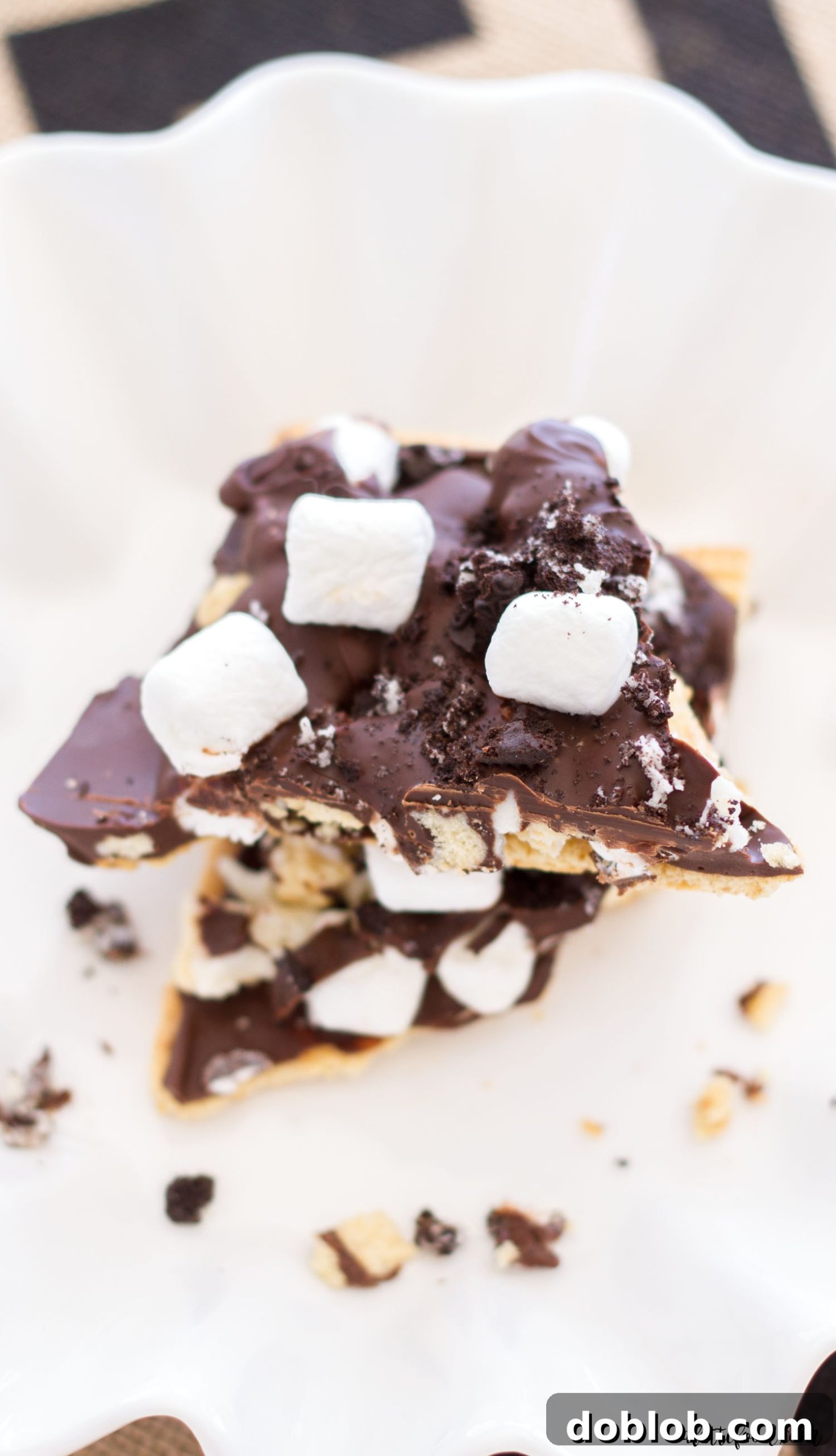 Close-up of S'mores Oreo Bark with golden and regular Oreos, marshmallows, and chocolate layers.