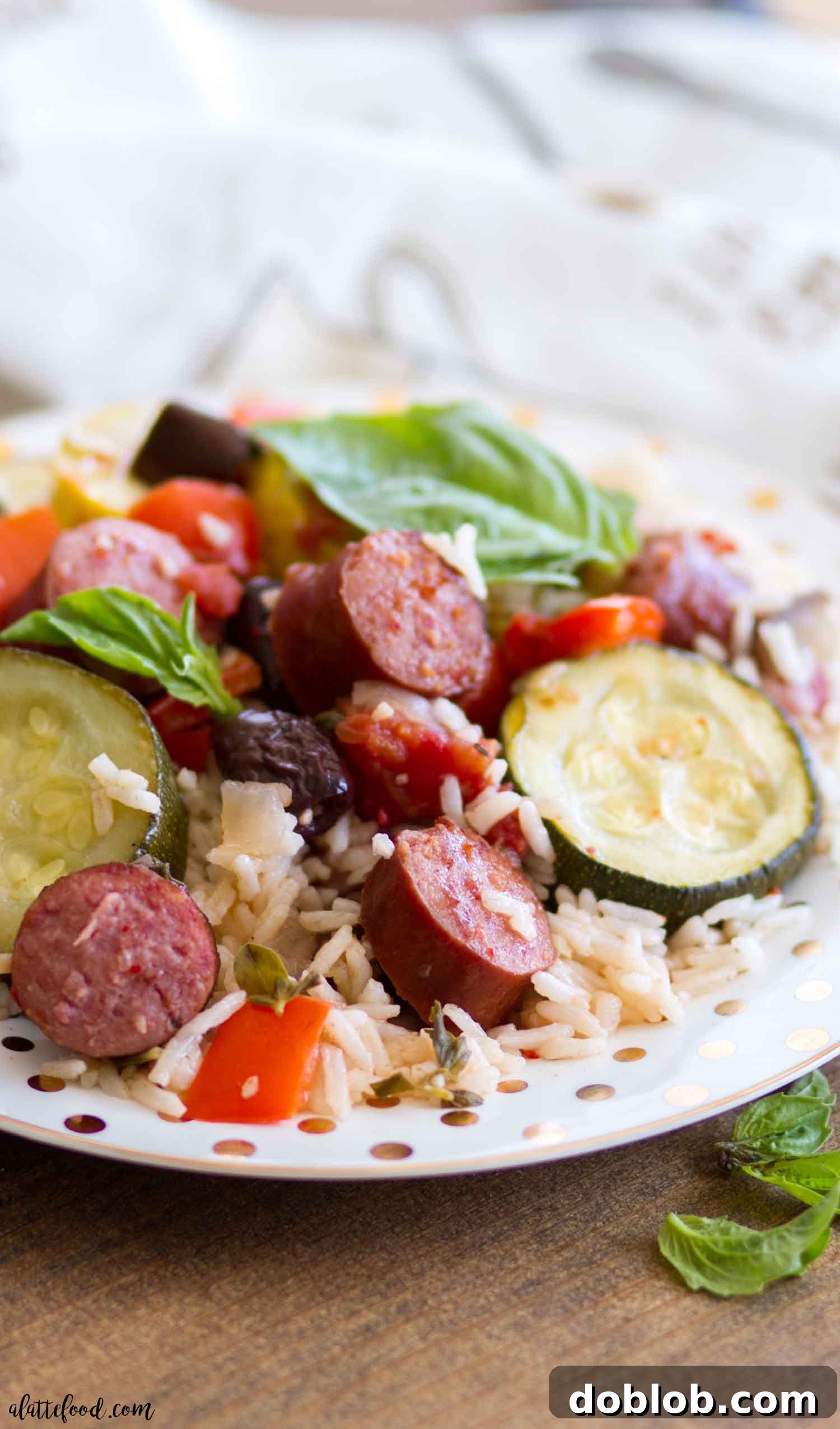 Roasted Ratatouille Bowl with Smoked Sausage and Jasmine Rice for Fall A beautifully presented Roasted Ratatouille Bowl, featuring colorful roasted vegetables like eggplant, zucchini, and bell peppers, mixed with slices of Hillshire Farm Beef Smoked Sausage, all served over fluffy Uncle Ben's Jasmine Rice. Perfect for a comforting fall dinner.