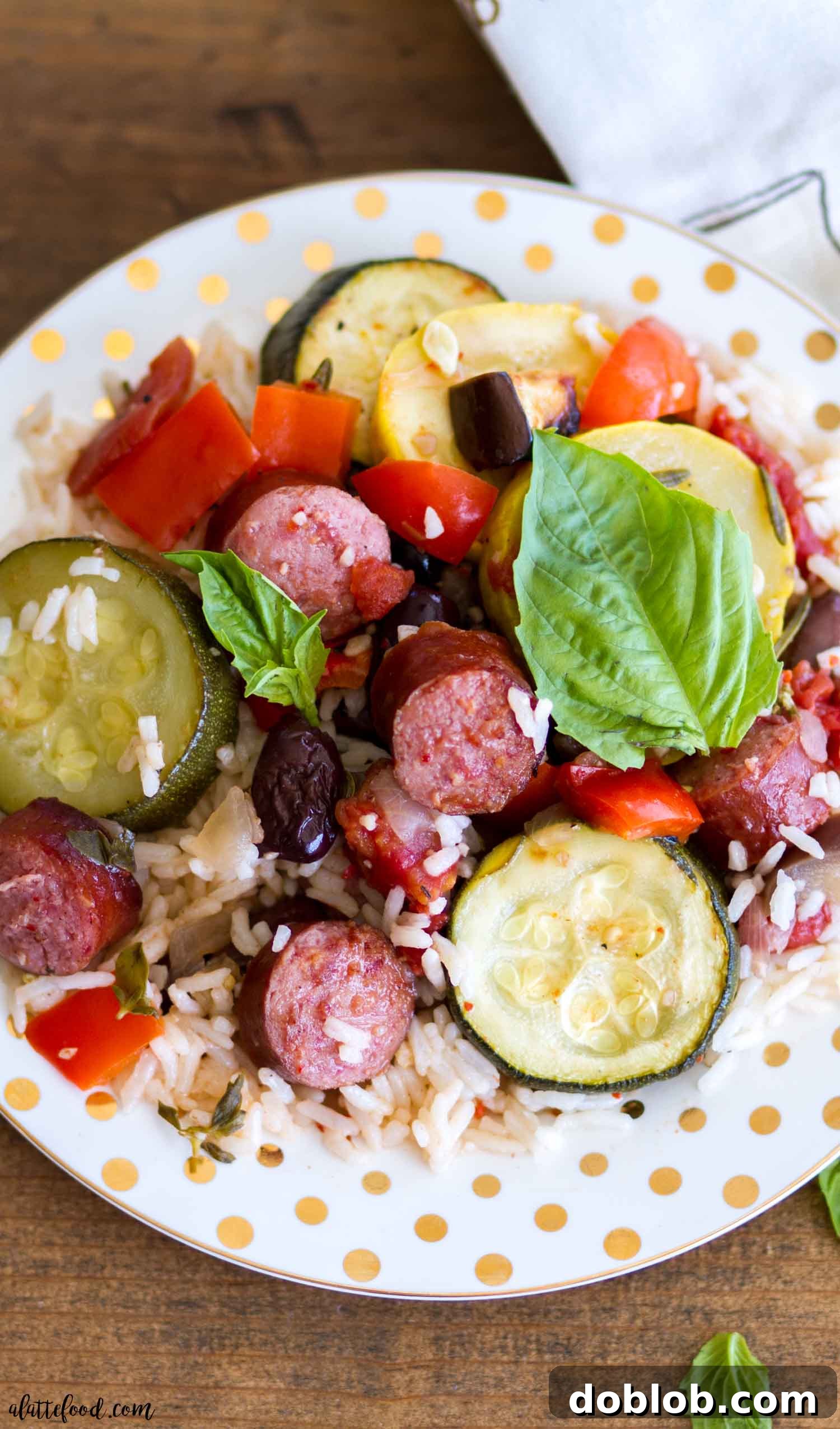 Roasted Ratatouille Bowl with Smoked Sausage and Rice An inviting close-up of the Roasted Ratatouille Bowl, showcasing a harmonious blend of tender roasted vegetables, juicy Hillshire Farm Smoked Sausage, and fluffy Uncle Ben's Jasmine Rice. Garnished with fresh basil, ready to be enjoyed.