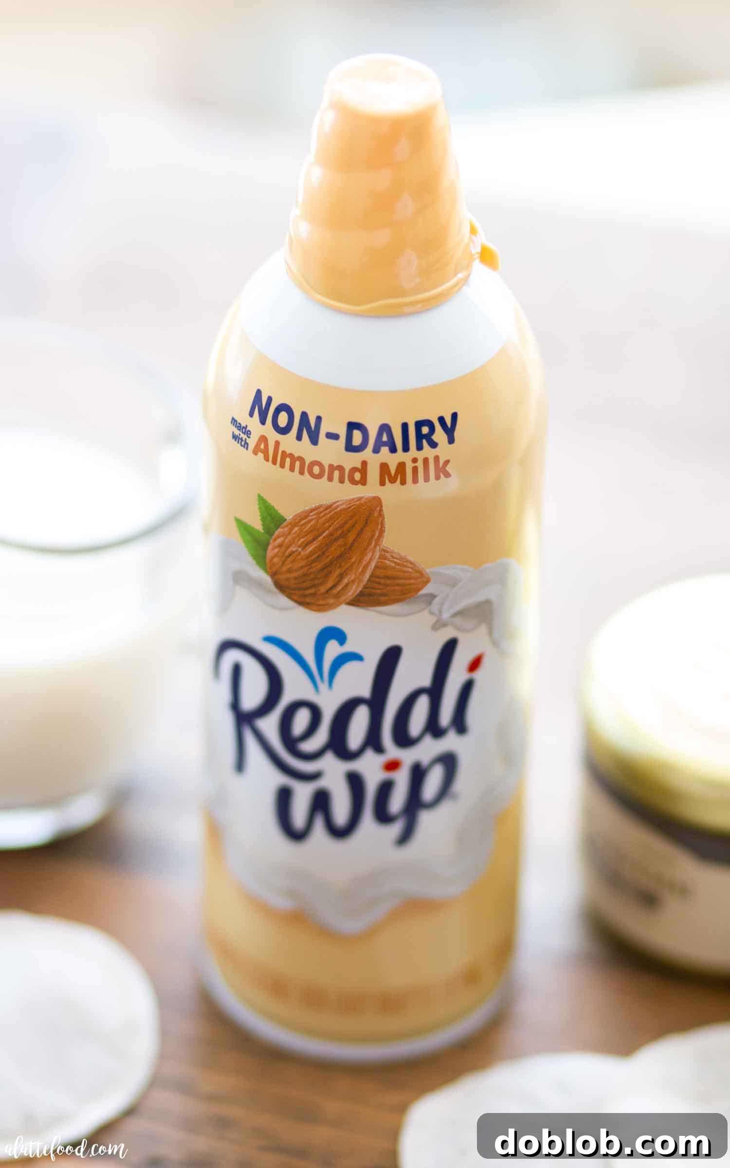 Easy chai latte with frothy almond milk and dairy-free almond whipped cream topping.